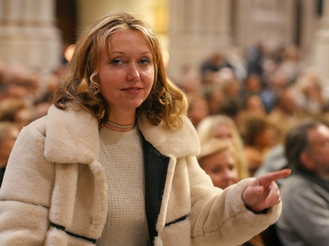 woman speaking confidently in front of audience