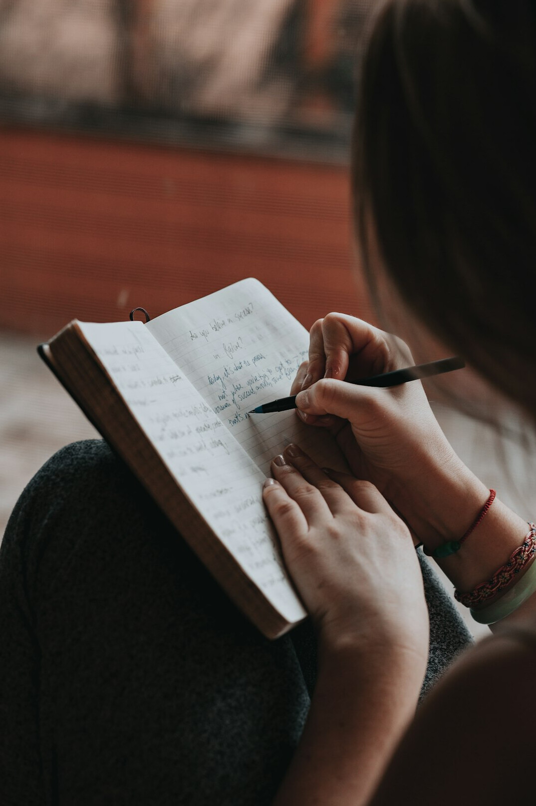 person journaling thoughts