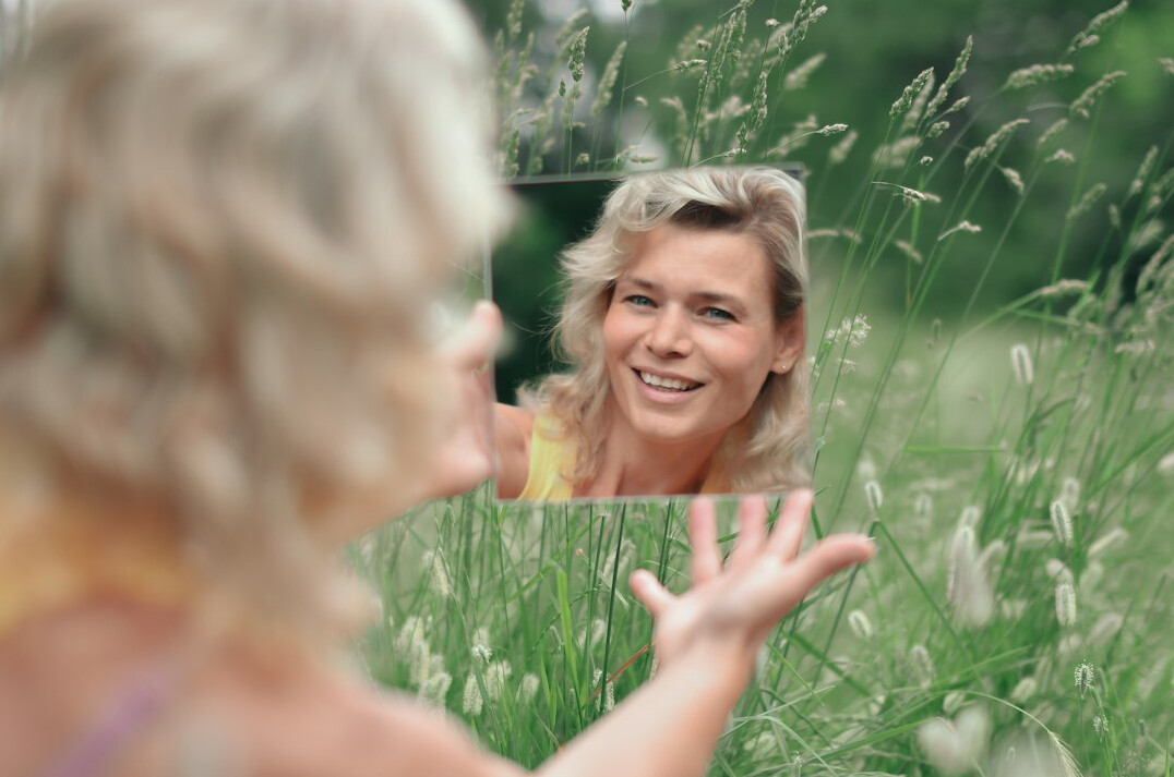 person practicing speech in mirror