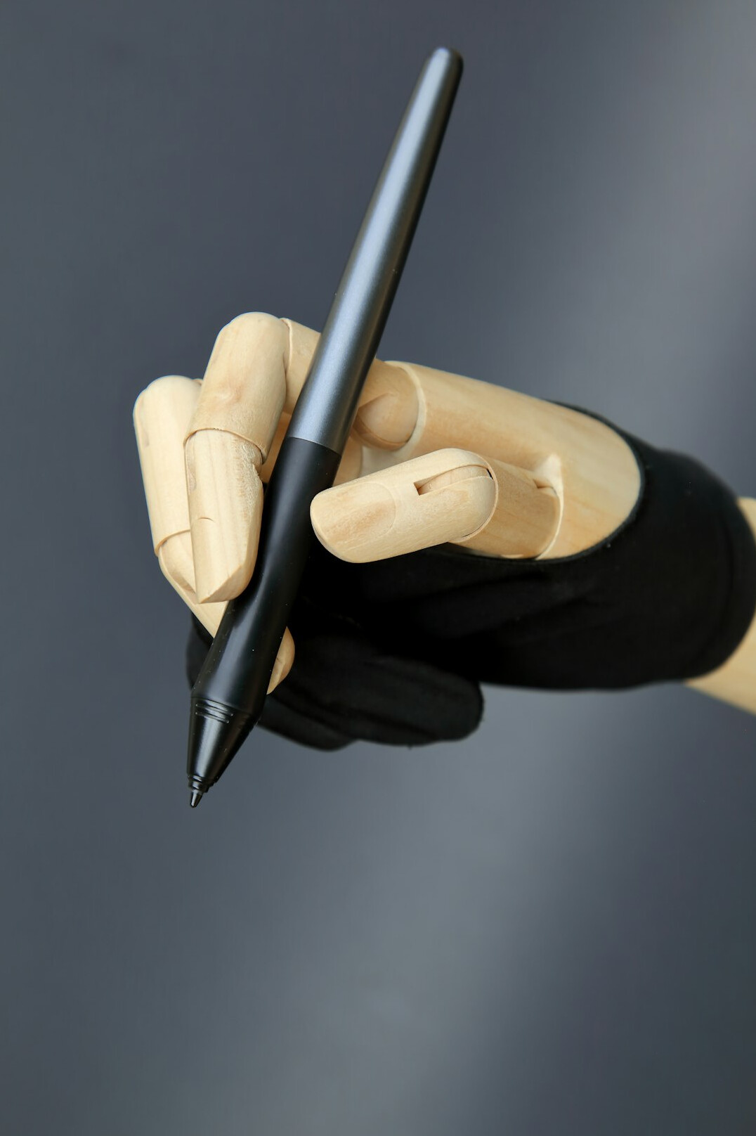 Hand writing in a notebook with a pen