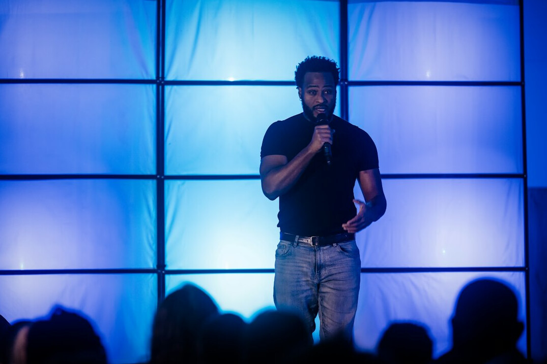 person speaking confidently on stage