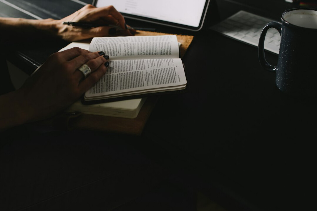 person journaling at desk