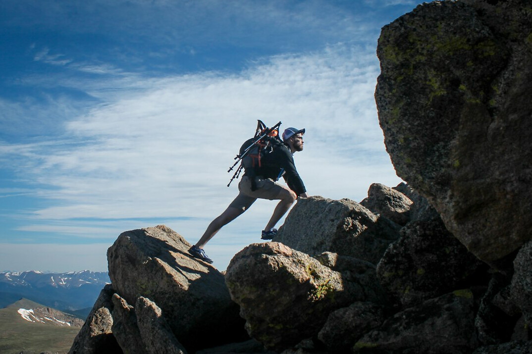 person climbing mountain