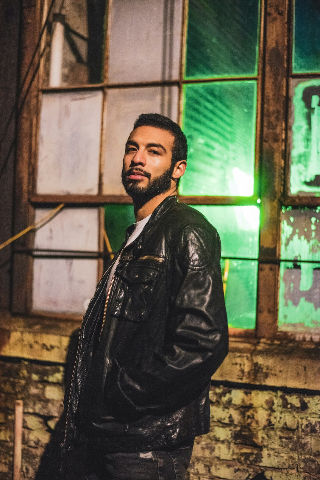 Portrait of a Latino man in a suit jacket